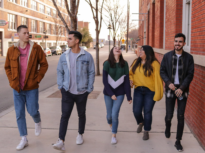 Young people walking down a street